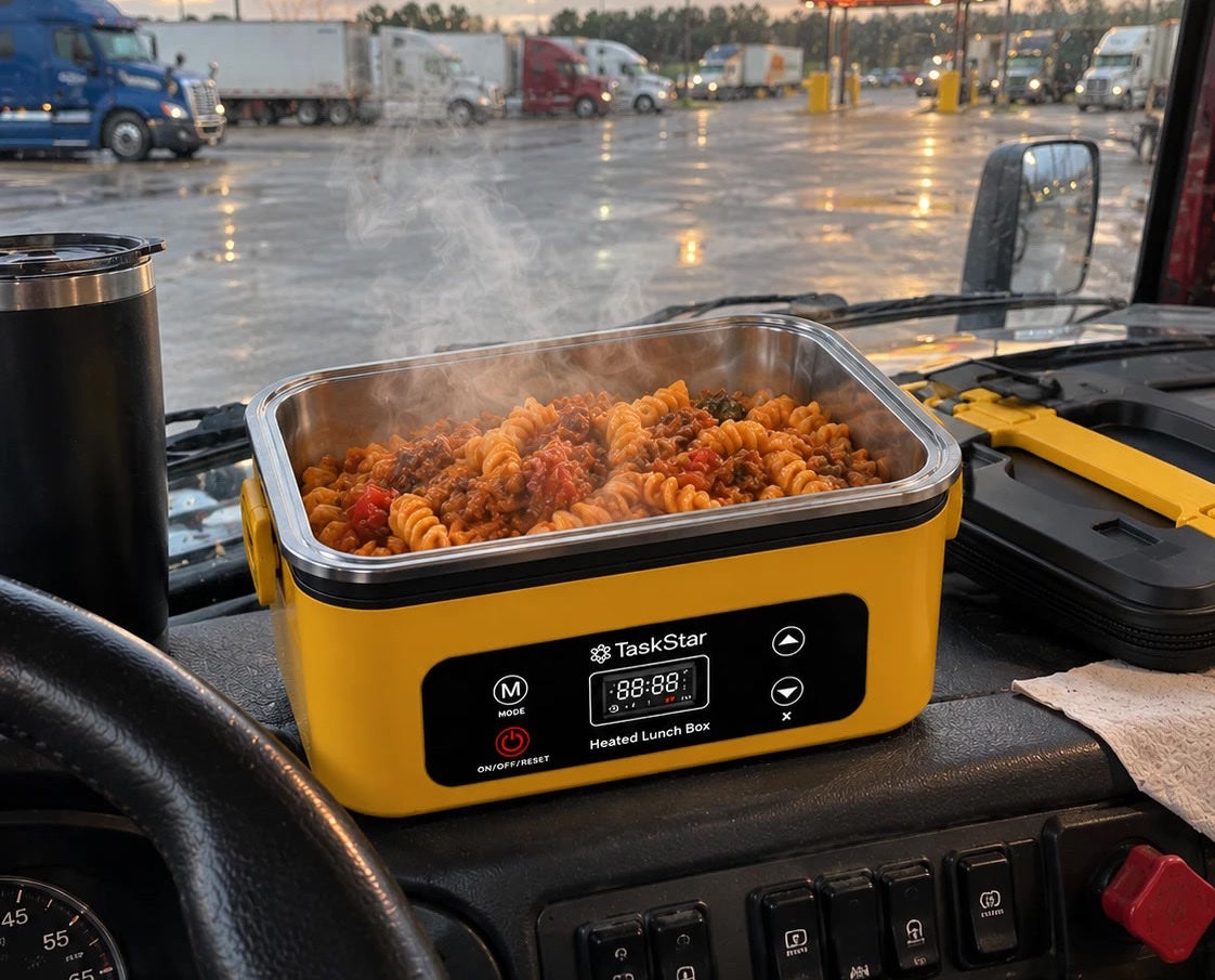 Heated lunch box with hot pasta on a semi-truck dashboard at a truck stop