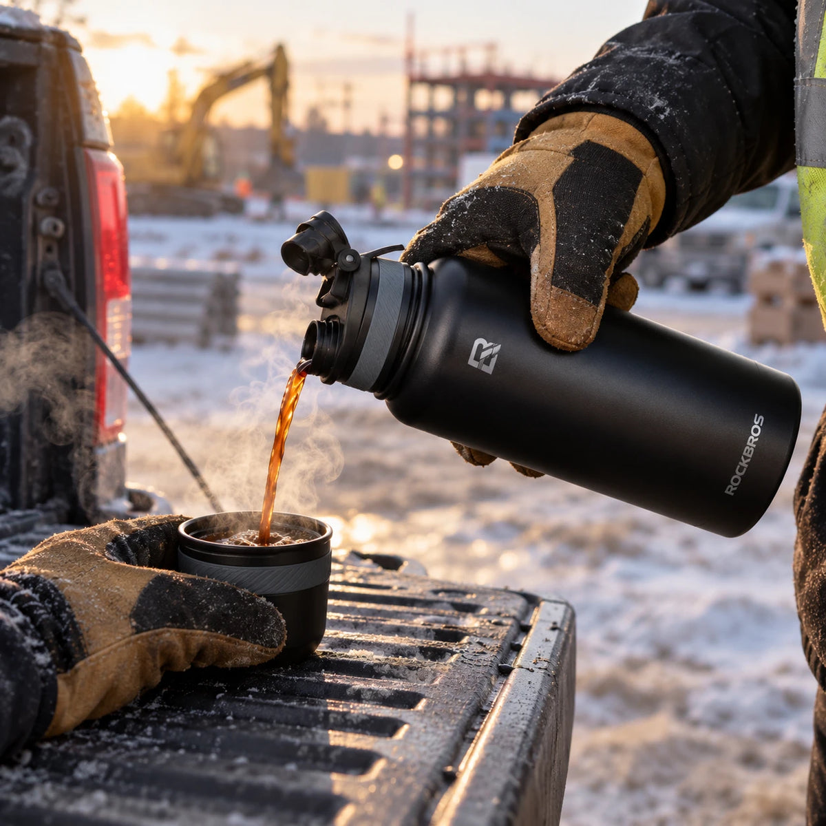 Pouring hot coffee from the black work flask on a tailgate